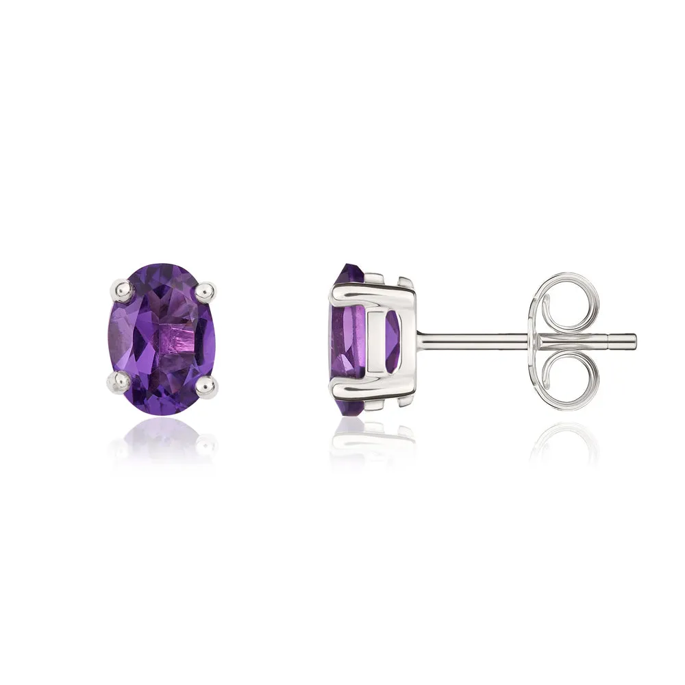 9ct White Gold Amethyst 7x5mm Oval Claw Set Stud Earrings