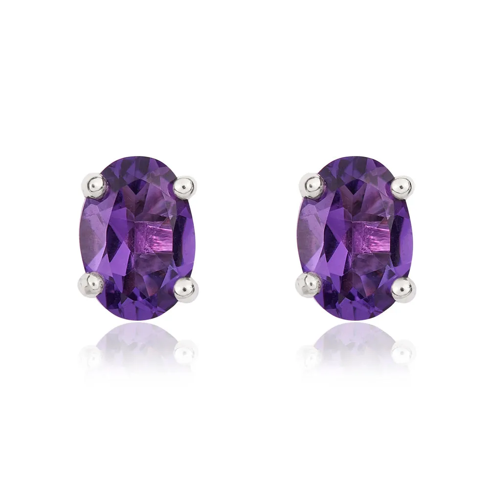 9ct White Gold Amethyst 7x5mm Oval Claw Set Stud Earrings