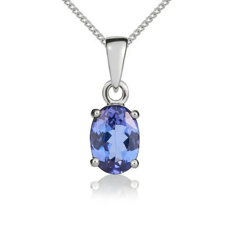 9ct White Gold Tanzanite 7x5mm Oval Claw Set Pendant and Stud Earrings Set